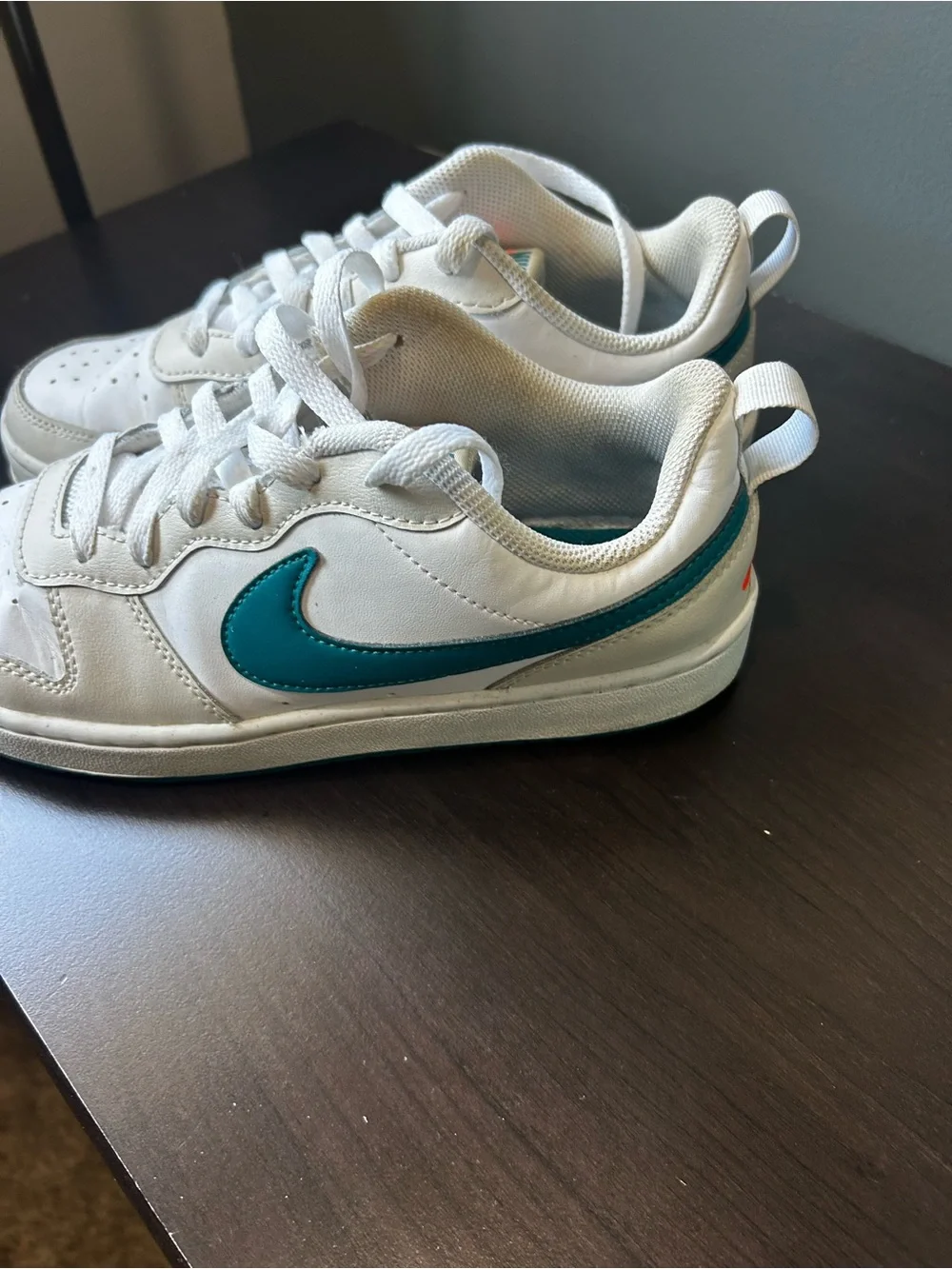 Nike White Low-Top Sneakers with Teal Swoosh Accent